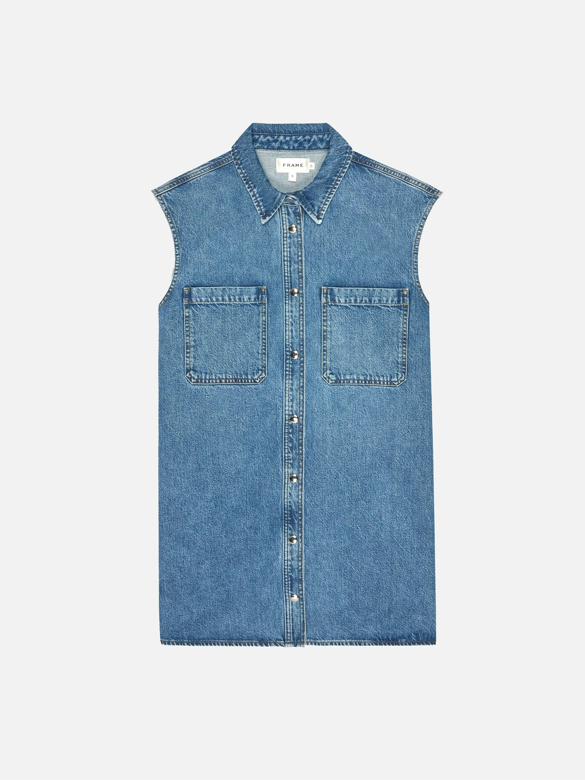 FRAME Sleeveless Shirt Dress in blue denim, featuring a collar, button-down closure, and two front patch pockets, displayed flat on a white background.