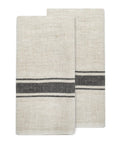 The CH Tea Towels S/2 by Faire feature two folded beige linen-cotton blend towels with a simple black horizontal stripe near the center, displayed side by side on a white background.