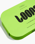 The bright green rectangular box labeled "Loops/HydroGel Face Masks" by Faire contains 5 moisturizing facemasks. The packaging has bold black text, rounded edges, and highlights exfoliation and hydration benefits in smaller print.