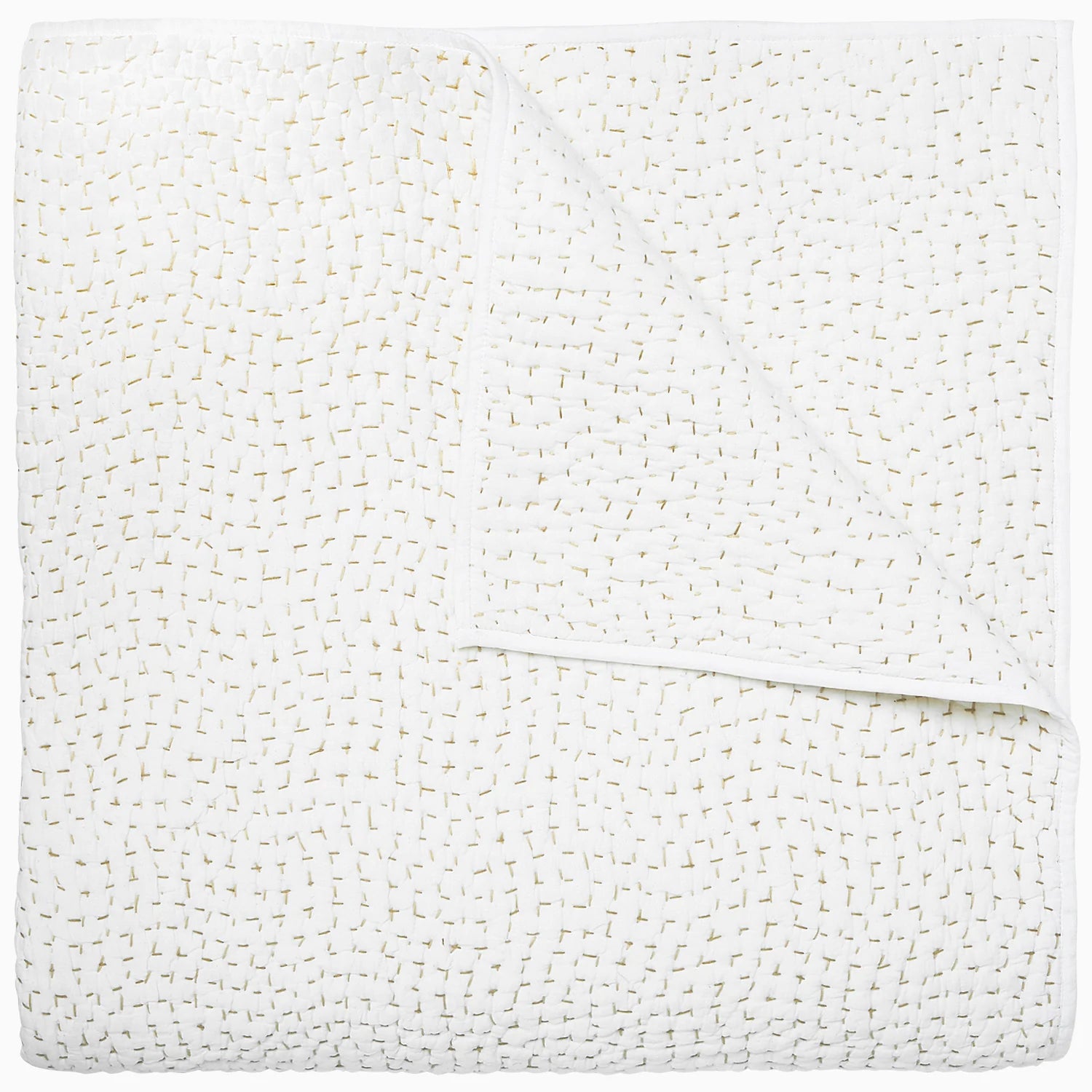White textured Coverlet King with a waffle pattern, neatly folded with slight creases visible, showcasing a fluffy and soft appearance in a Scottsdale, Arizona bungalow by John Robshaw.