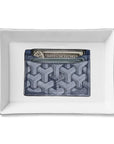 The Faire Ceramic Tray features a blue patterned cardholder with cash and an American Express card, centered on a white background—ideal as a stylish organizer or thoughtful gift.