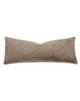 A rectangular, bone-shaped Adri Faux Fur Pillow in a light beige color, inspired by the serene aesthetics of Scottsdale, Arizona, laid on a plain white background. (Brand Name: Eastern Accents)
