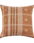 The Bhujodi Wool Pillow by Indaba is a 20-inch decorative cushion with a woven texture, featuring a warm brown background and cream geometric patterns like stripes, diamonds, and small crosses.