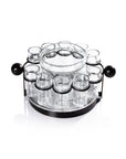 The Zodax IN-8239 Ten Shot Tequila Set w/Ice Bucket pairs perfectly with a clear glass server set featuring a central bowl and small jars, all on a round black metal rotating stand—ideal for serving condiments with your tequila.