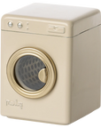 The Maileg Furniture by Maileg is a small, beige toy washing machine with a round gold front door and simple top buttons—perfect as dollhouse furniture or to add charm to any cute collection.