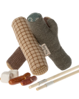 A charming Maileg Furniture set by Maileg featuring plush toy logs arranged like a campfire, small plush food items, and toy chopsticks—ideal for dollhouses or Maileg Mouse displays, all set against a white background.