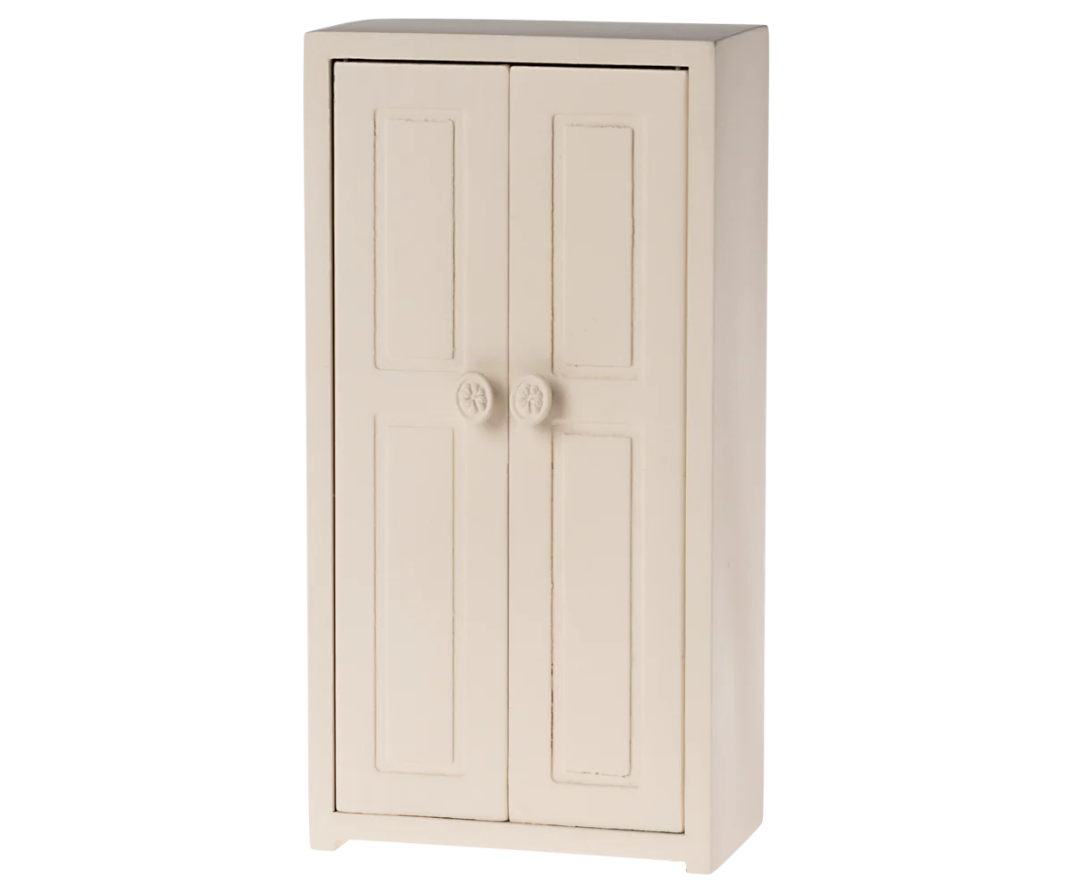 The Maileg Furniture cabinet by Maileg is a light wood piece with two doors featuring round knobs and rectangular panels—ideal for dollhouses or as cute miniature décor.