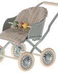 The Maileg Baby Stroller by Maileg is a small toy double stroller with a light gray frame, beige handle, cushioned striped seat, four cream wheels, and three wooden beads—perfect for pretend play with multiple babies.