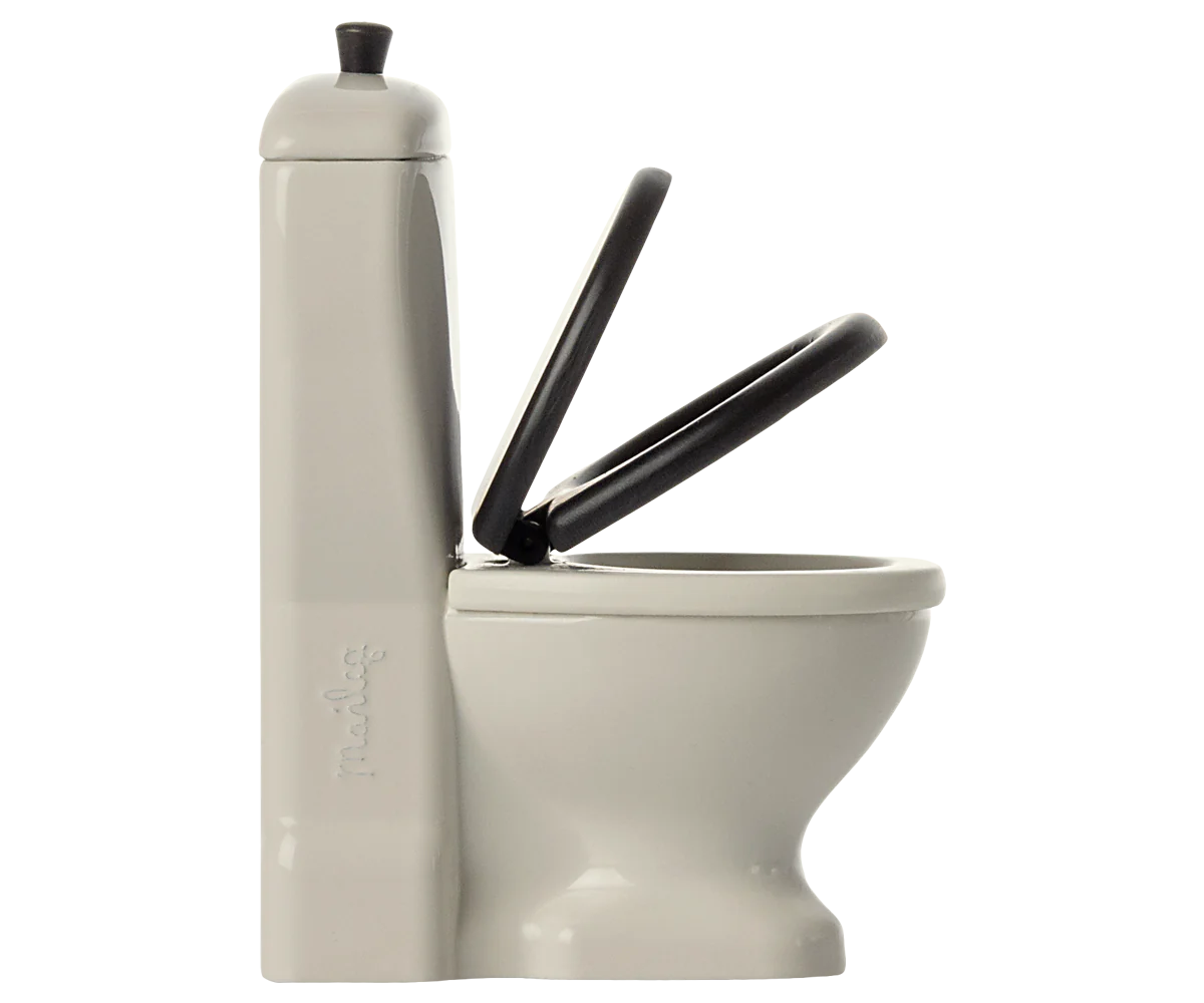 The Maileg Furniture White Toilet by Maileg features two raised black seats and a tall, narrow cistern on the left, ideal for Mouse dollhouses. Shown against a plain background.
