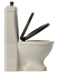 The Maileg Furniture White Toilet by Maileg features two raised black seats and a tall, narrow cistern on the left, ideal for Mouse dollhouses. Shown against a plain background.