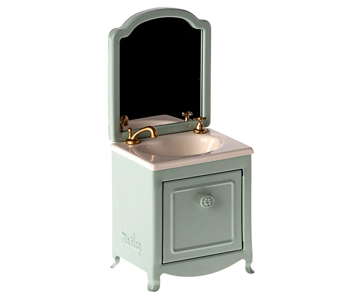 Add a chic touch to any Maileg Mouse house with Maileg Furniture: this miniature bathroom sink features a gold faucet, white basin, and light blue cabinet with matching mirror—ideal dollhouse decor from Maileg.