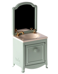 Add a chic touch to any Maileg Mouse house with Maileg Furniture: this miniature bathroom sink features a gold faucet, white basin, and light blue cabinet with matching mirror—ideal dollhouse decor from Maileg.