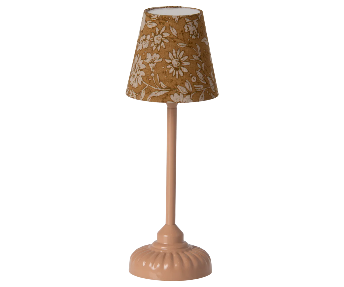 The Maileg Furniture table lamp by Maileg features a pink base and a brown lampshade with white floral patterns—a charming accessory for any dollhouse.