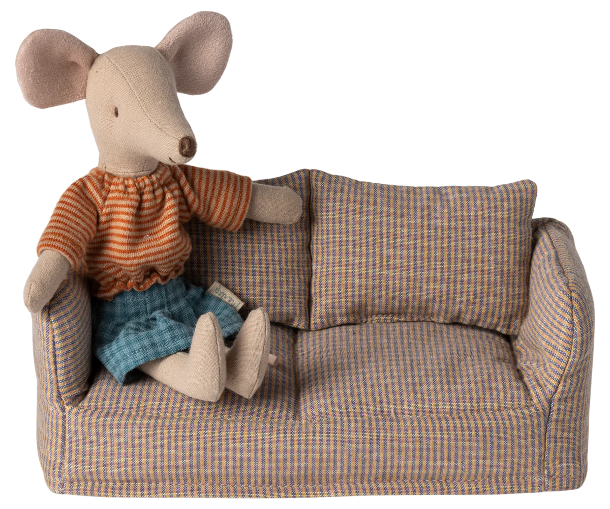Maileg Furniture by Maileg features a mouse in a striped orange shirt and blue shorts sitting on a small plaid sofa with matching cushion—perfect for charming dollhouse furniture or any cute collection.
