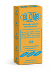 A yellow and blue perfume box labeled "Blomb Eau de Parfum" by Faire reads, “We make scents for everyone.” Scent notes: citron, marigold, bergamot, skin musk. The box invites you to insert your own FRESH scent fantasy here.