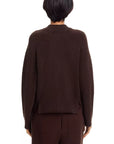 A person with short dark hair is shown from the back, wearing the Rag & Bone bridget mock neck cardigan in dark brown wool blend with matching pants—a cozy cold weather layer—against a white background.