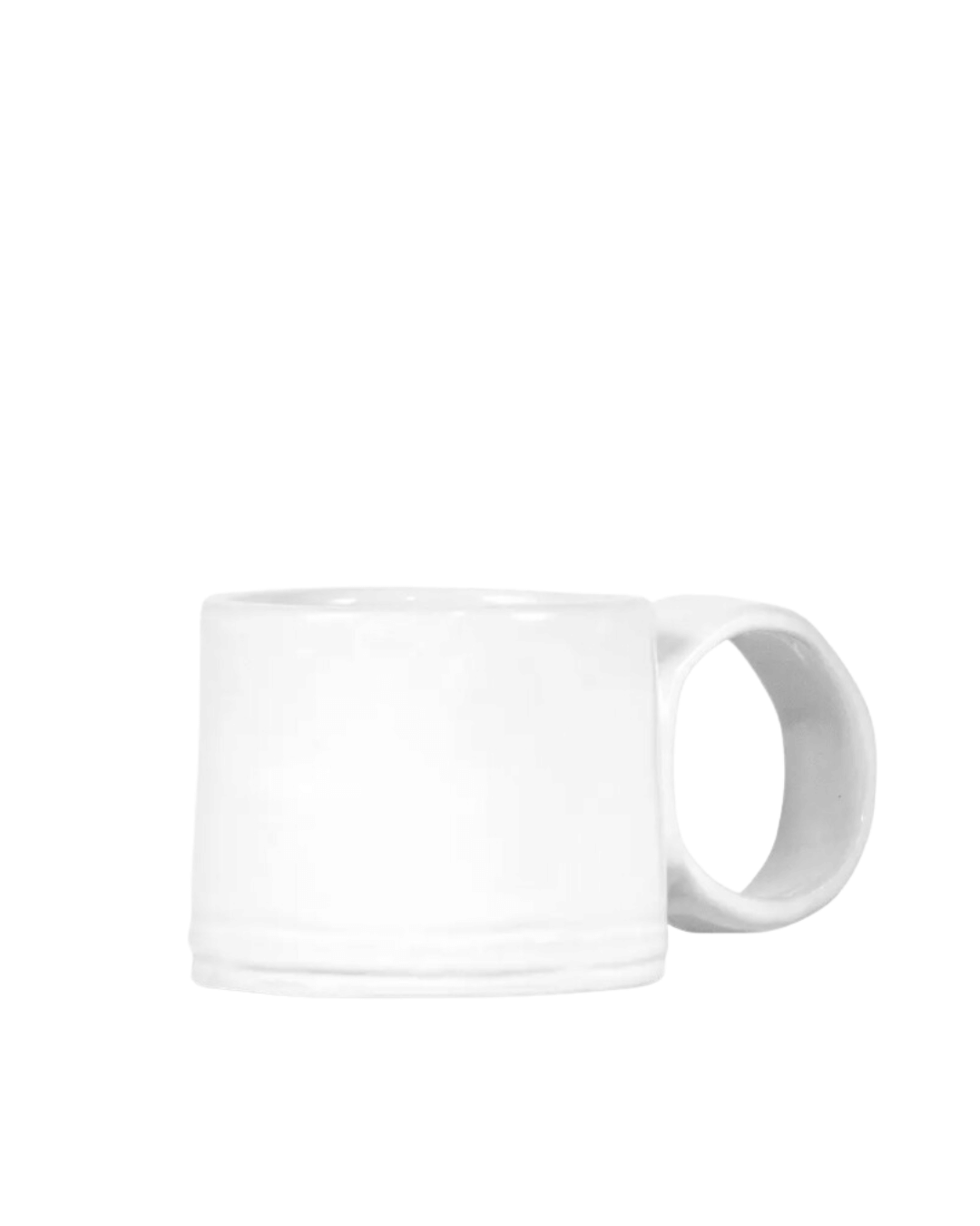A Montes Doggett Espresso Cup No. 926 with a visible handle, displayed against a white background, creating a minimalistic look reminiscent of a Scottsdale Arizona bungalow.