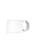 A Montes Doggett Espresso Cup No. 926 with a visible handle, displayed against a white background, creating a minimalistic look reminiscent of a Scottsdale Arizona bungalow.