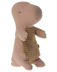 The Maileg Gantosaurus in Egg is a soft, brown dinosaur toy with small arms, stitched details, and a striped light brown belly, shown standing upright against a plain white background.