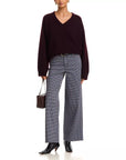 FRAME Le Slim Palazzo jeans with maroon V-neck sweater, styled with black boots and brown handbag.