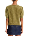 Olive green pointelle cashmere cardigan by FRAME paired with a dark denim mini skirt, back view.