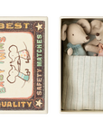A small Maileg Mouse box from Maileg holds two mice in polka dot clothes, snuggled in a blue striped blanket. Part of the Maileg mice family; colors may vary.