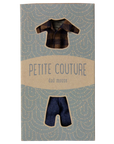 A Maileg cardboard package labeled "Maileg Dad Mouse Outfit" shows a tiny flannel shirt and classic jeans for toy mice, visible through two cutout windows.