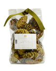 A clear bag of Potpourri Pine Cones by Faire, filled with pine cones scented with cedar and pine, and tied at the top with an olive green ribbon.