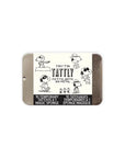 The Tattly Tattoo Tin by Faire is an illustrated tin with playful cartoon characters. The label says "Tiny Tin Tattly Petite Boîte en Métal," featuring "10 Tattly Temporary Tattoos & 1 Magic Sponge" in English and French. Enjoy vibrant, non-toxic designs perfect for safe creative expression.