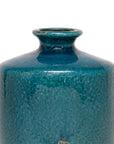A close-up of the upper part of The Import Collection’s Newton Short Vase reveals its narrow neck and glossy turquoise glaze with rich texture and subtle color variations, set against a plain white background.