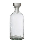 The Creative Co-op Decanter 20oz features clear glass, a narrow neck, round flat-topped stopper, and a textured surface—an essential for modern hosts—shown against a plain white background.