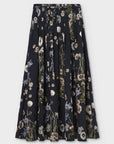 Black silk-blend skirt with white, purple, and green floral print by Psophia, flared hem, waistband detail.