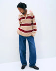 White + Warren Cashmere Rugby Stripe Polo in white with blue stripes, styled casually with wide-leg jeans and loafers.
