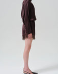 Lace Trimmed Tap Shorts by Citizens Of Humanity styled with black heels, shown in side profile against a plain backdrop.