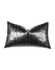 A black leather rectangular Muse Pillow by Eastern Accents with white stitched accents and a Bungalow-style metallic clasp in the center, isolated on a white background.