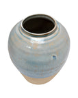 The Import Collection's Moroson Vase is a ceramic piece with a wide opening, glossy blue glaze on the upper half, and an unglazed beige base, shown against a white background.