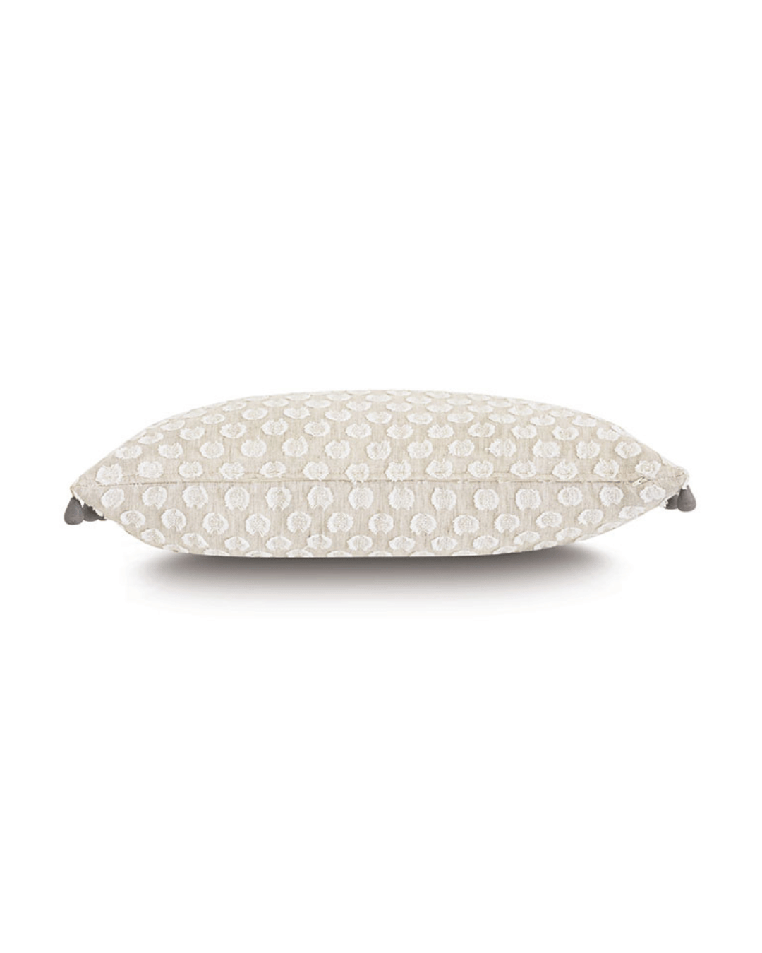 Eastern Accents' Beaded Trim Decorative Pillow with a textured white cover featuring a dotted pattern, displayed in a bungalow-style against a plain white background.
