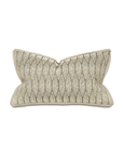 An elegant beige Butterfly Pleat Pillow from Eastern Accents shaped like a bow tie with textured, leaf-like patterns, isolated on a white background, perfect for a Scottsdale bungalow.