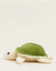 The Turtle Warmies Junior by Faire is a soft, microwavable plush with a green shell and beige body, featuring black round eyes and a cute design—perfect as a cozy sensory toy.