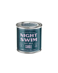 A teal tin labeled "G&W Soy Candle" from Faire features pink and white text, scent notes, "Hand Poured Small Batch," "Burn Time 45 hrs," and "8 oz." The bottom of the candle displays the Good & Well Supply Co. name.