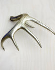 Gilded four-point antler accent by Bungalow Furniture adds rustic charm and unique style to your decor.