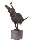 The Import Collection's Bull Statuary features an abstract bronze bull standing on two legs with a raised head and front leg, set atop a square stone base for bold, modern home decor.