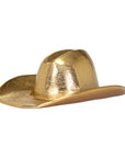 The Import Collection's 44-230 Westin Hat is a shiny, metallic gold cowboy hat with a wide brim and creased crown—ideal as a unique western home decor accent or stylish gold decoration. Photographed on a white background.