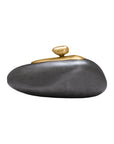 The Import Collection’s Finkle Large Box features a smooth dark stone base with two small, aluminum-like gold stones stacked on top, creating a striking decorative piece against a plain white background.