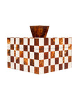 The Import Collection’s Camiro Short Box features a rectangular design with a white and amber-brown checkerboard pattern and a matching geometric handle, shown against a white background.