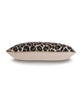 Gira Spot Pillow with a leopard print on one side and a plain beige fabric on the other, displayed against a bungalow-inspired backdrop in Scottsdale, Arizona by Eastern Accents.