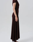 Kira sculptural dress by Citizens Of Humanity, side view on model against neutral background.