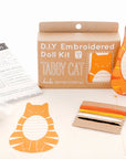 The Faire Tabby Cat Embroidery Kit includes instructions, stuffing, colorful floss, a cat-shaped cutout, and all you need to craft your own charming orange tabby cat doll with the classic Tabby Cat Pattern.