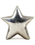 The Zentique Distressed Metallic Star is a five-pointed silver sculpture that stands upright, adding modern flair and striking style to your home decor.