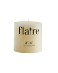A cream-colored, unscented 4x4 pillar candle by Creative Co-op features “Unscented Candle 4x4” on the front in black text. This round candle has a smooth finish, single wick, and offers a long burn time.